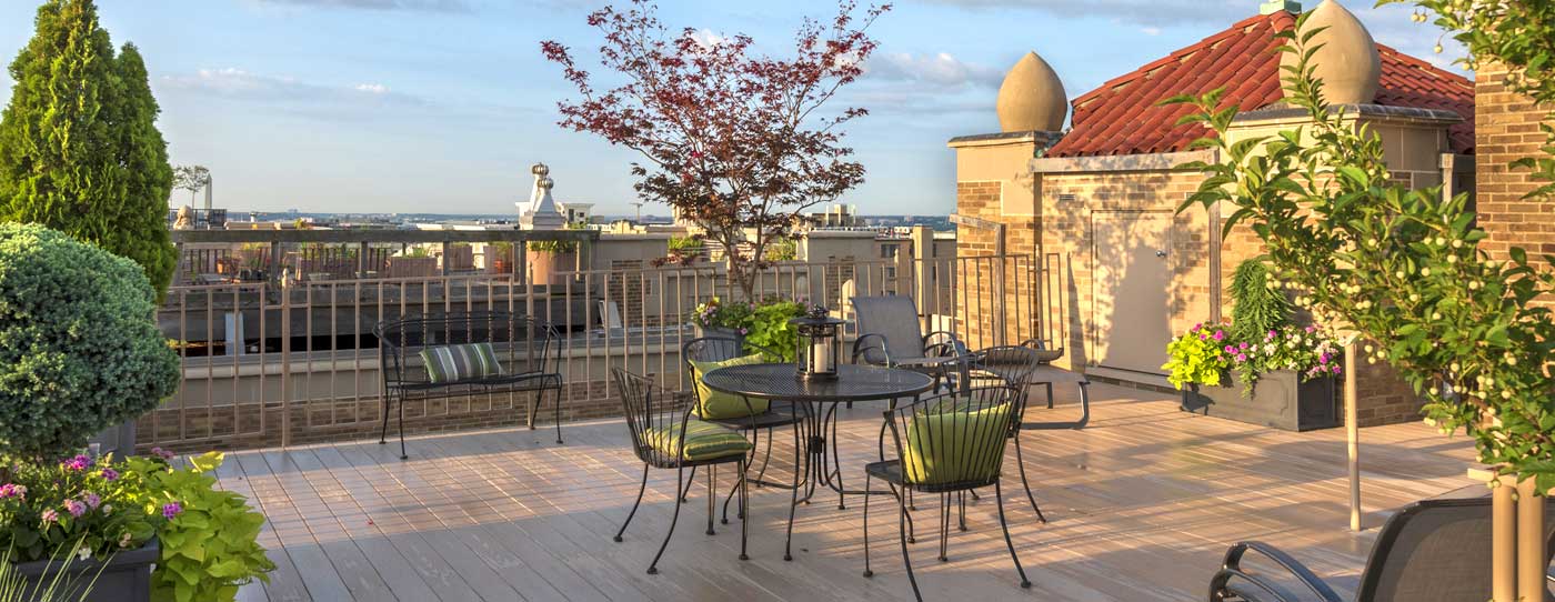 Installation of rooftop patio with potted plants